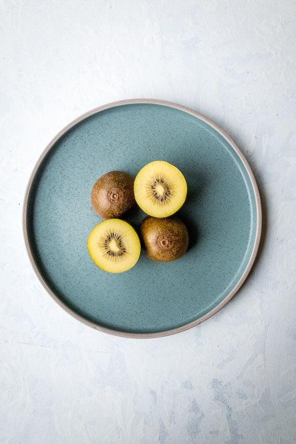 Gold Kiwi Cut Half Blue Plate