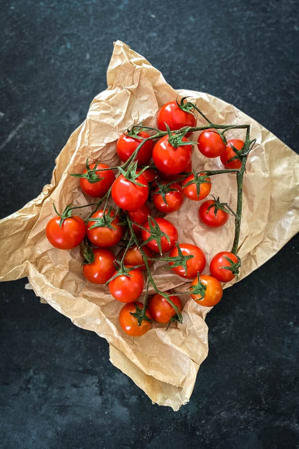 Trussed tomatoes brown paper bag