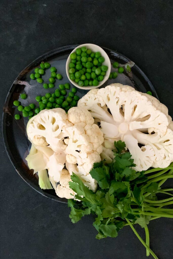 Peas, cauliflower steaks, coriander