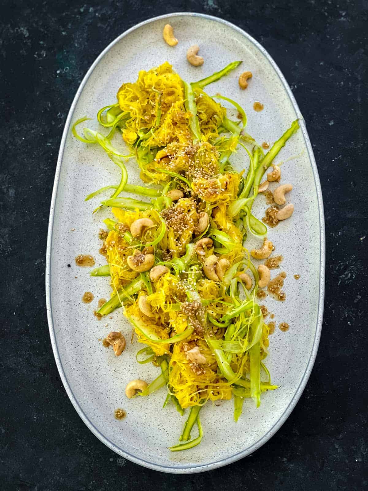 Spaghetti Squash Salad with Asparagus on an oval platter