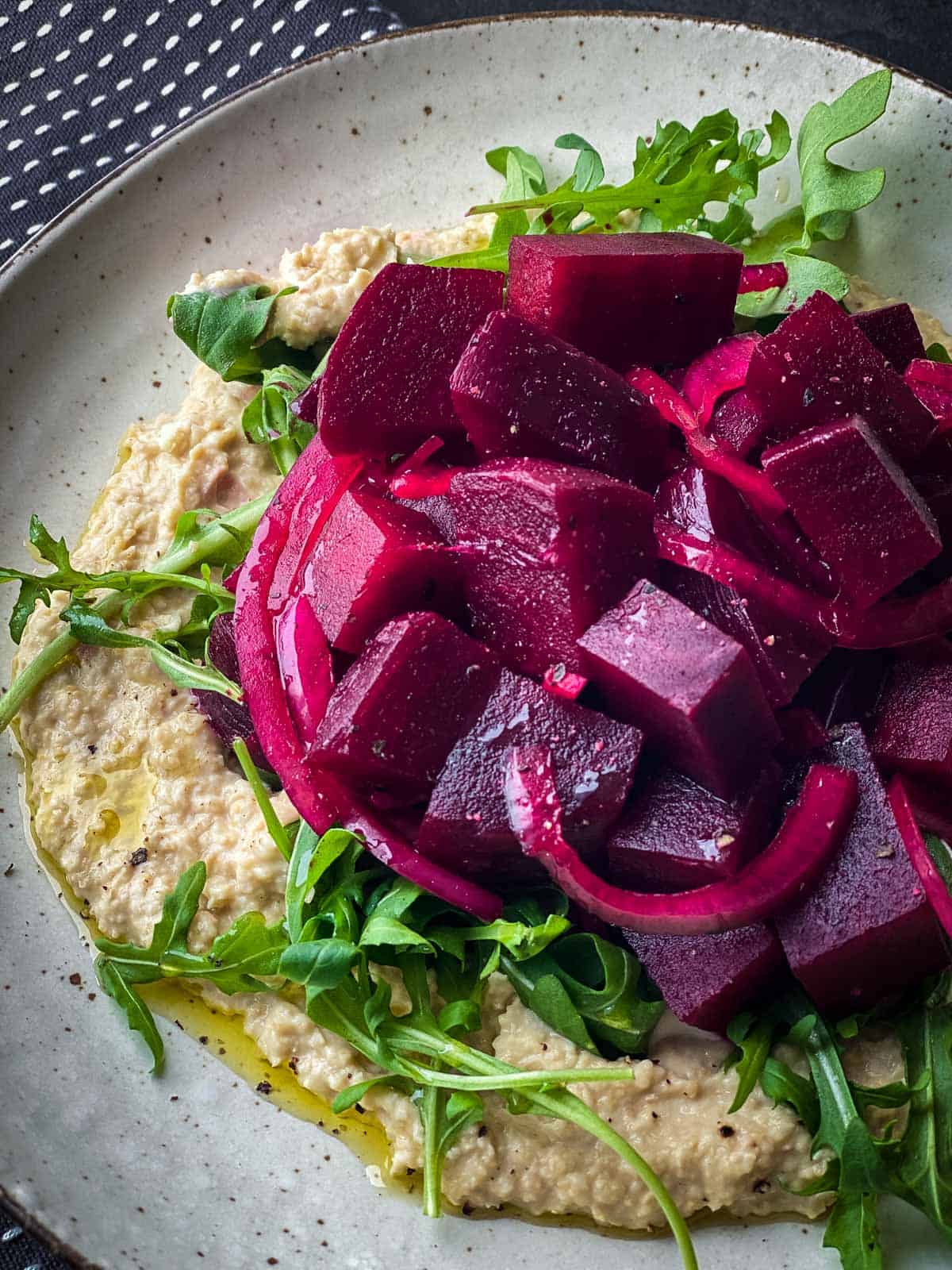 Pickled Beet Salad with Chickpea Mash on a white plate