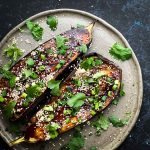 Roasted Asian Eggplant with Gochujang Glaze on a brown plate