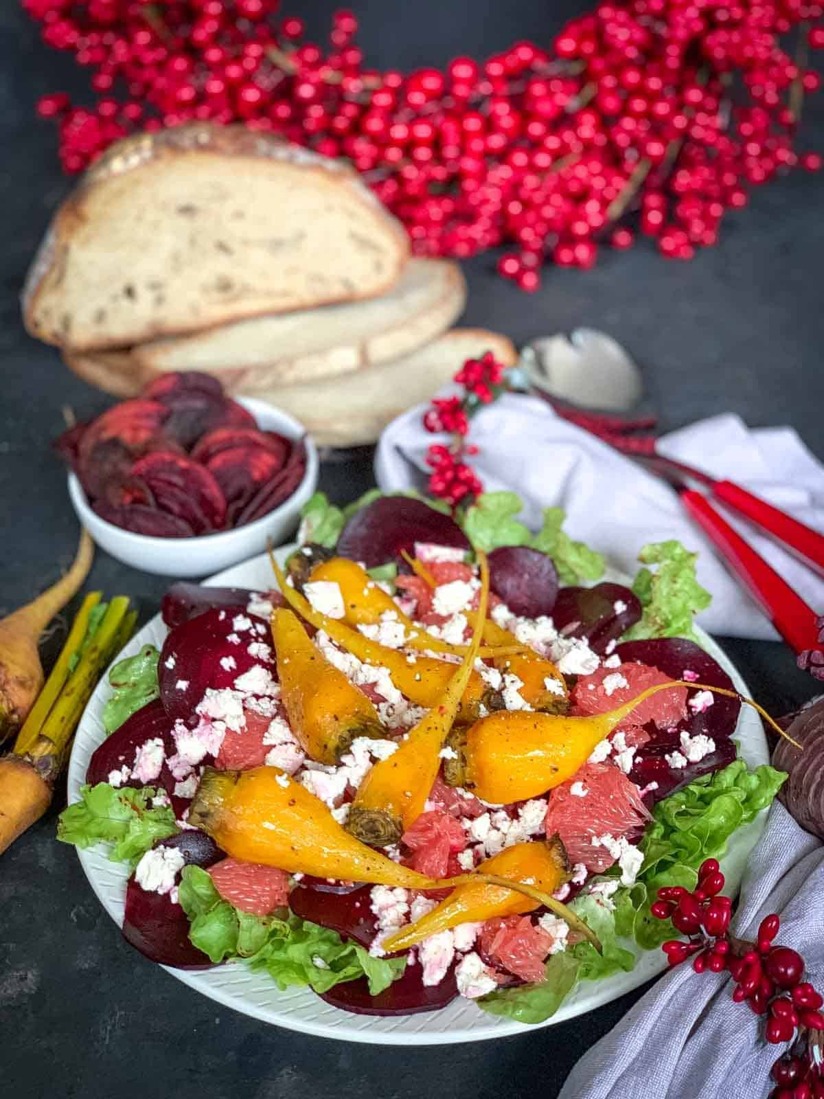 Christmas Beetroot and Feta Salad with berry garlands. freshly sliced bread and red salad 