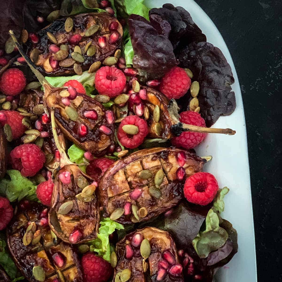 Tamarind Roasted Baby Eggplant Salad on a large oval platter