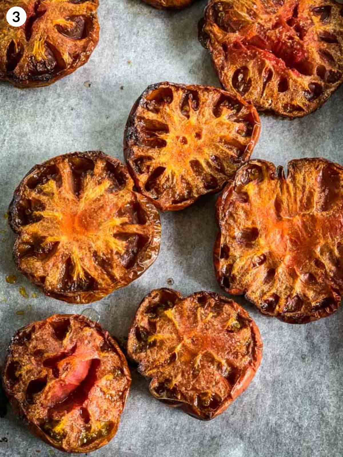 Roasting heirloom tomatoes on parchment lined baking tray