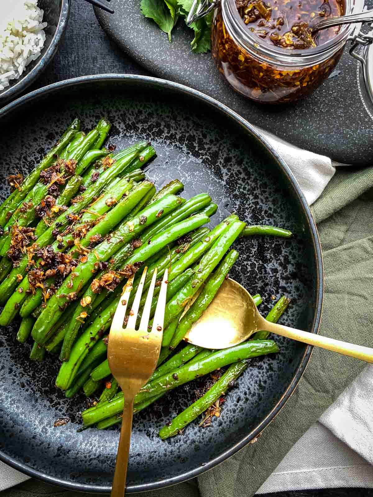 Lemongrass Chilli Green Beans Stir Fry served with a bowl of rice and bun bo hue sate