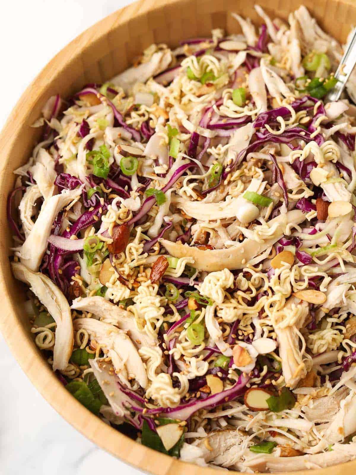 Chinese chicken salad in a wooden salad bowl