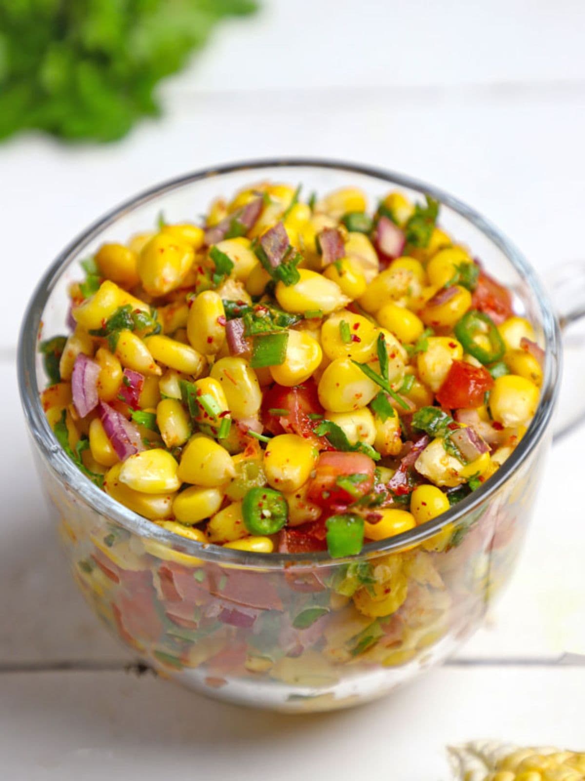 Corn chaat salad in a glass bowl