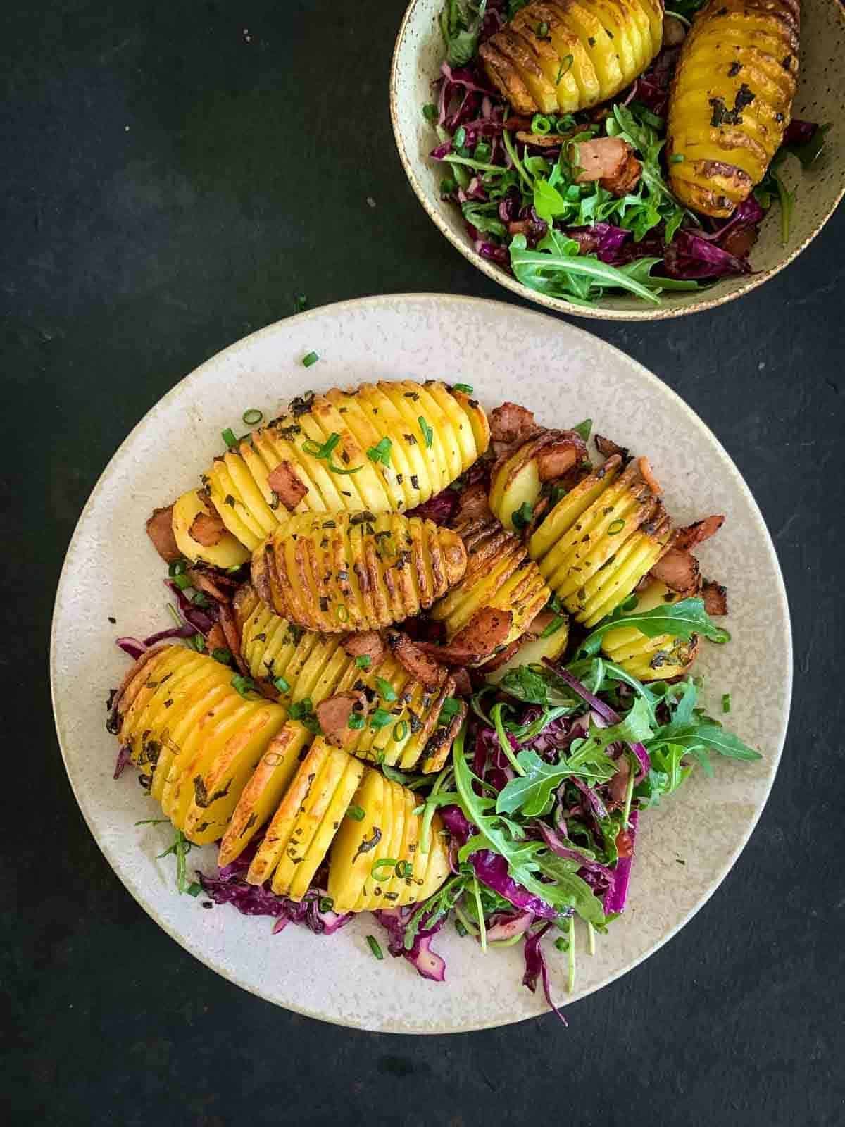 2 serves Hasselback potato salad with arugula