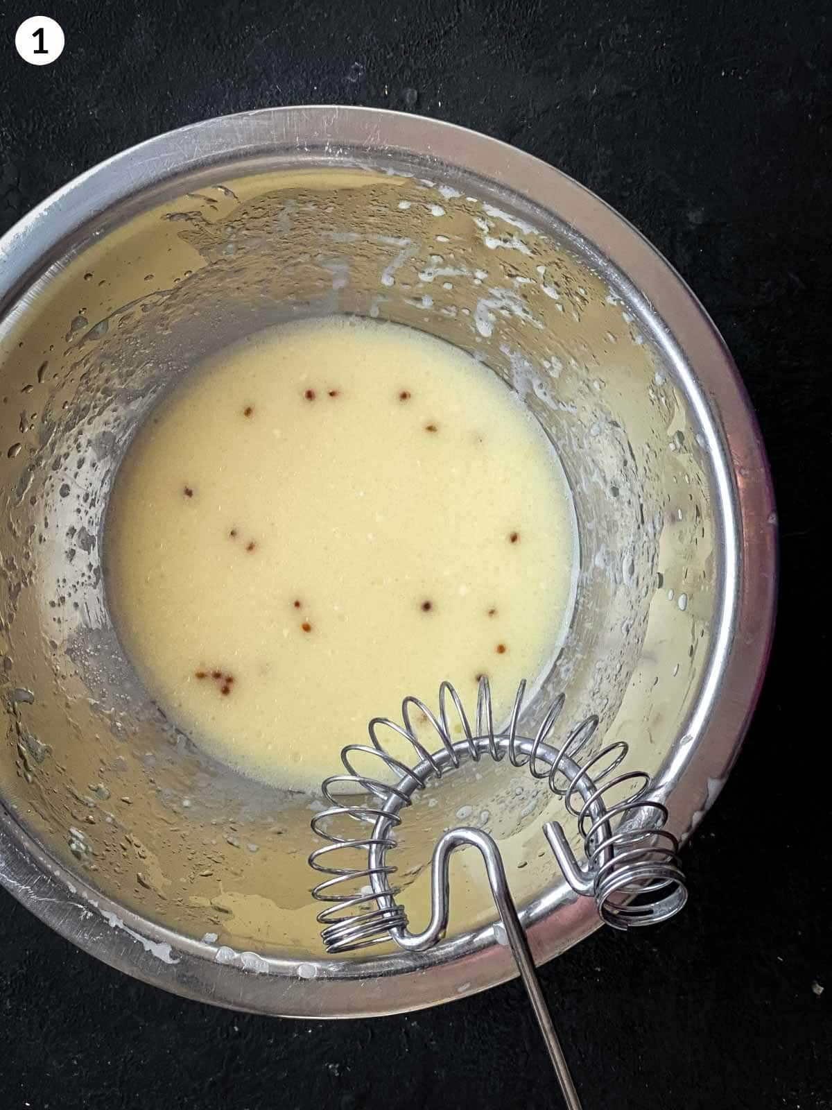 salad dressing whisked in a small mixing bowl