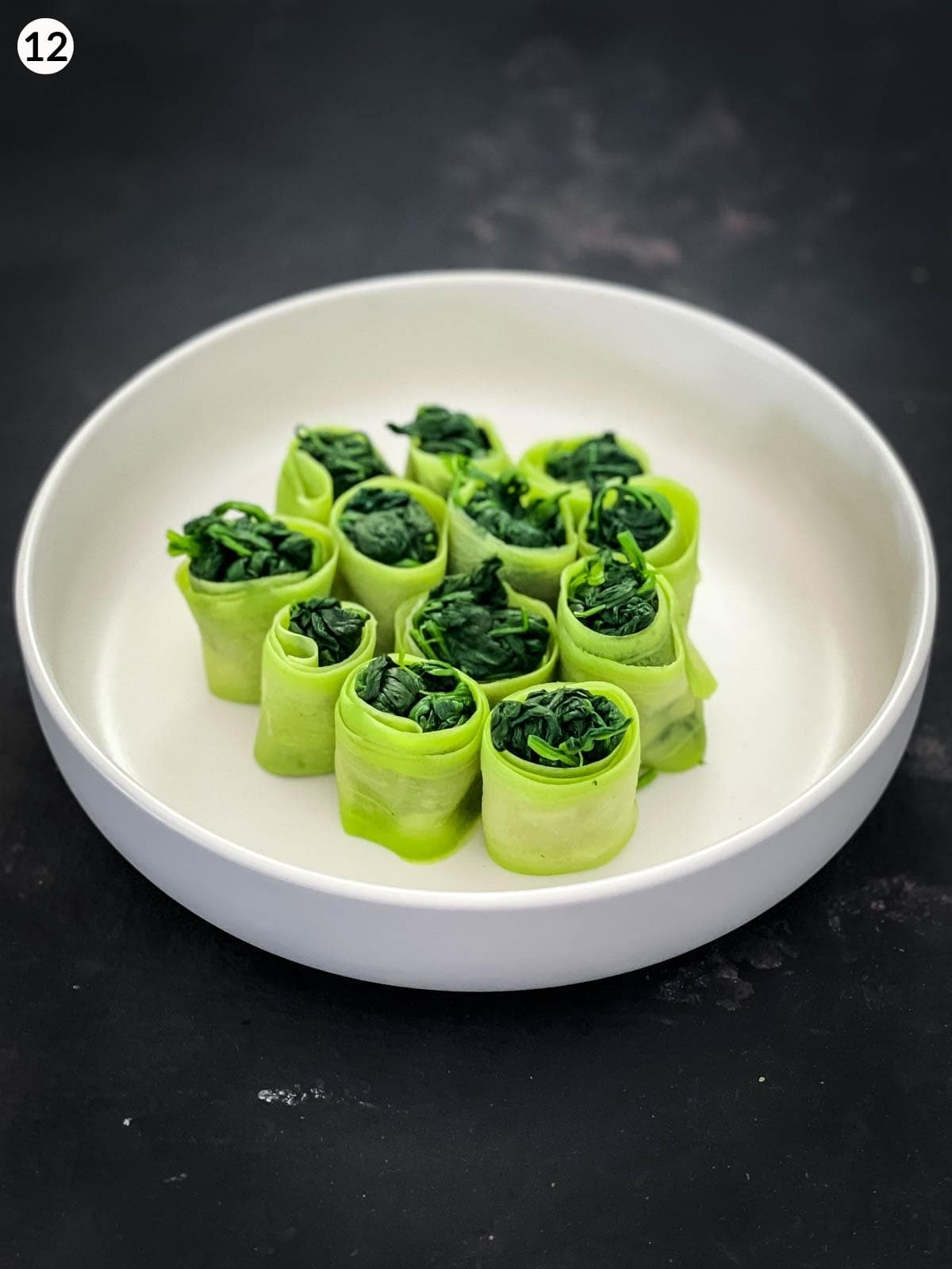 Chinese Squash and Spinach Rolls in a white serving bowl