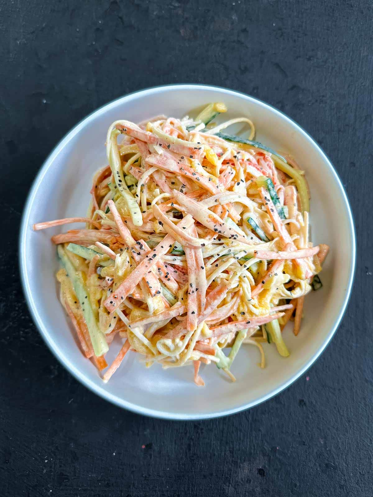 Kani salad in a white bowl