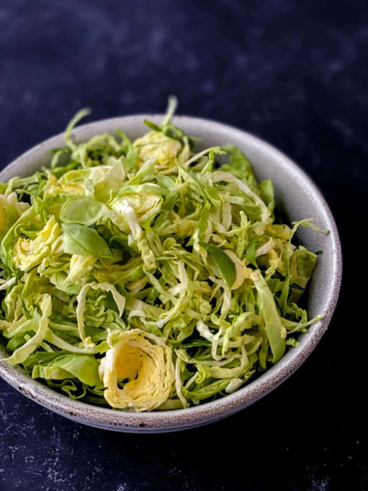 Shredded green brussels sprouts in a bowl