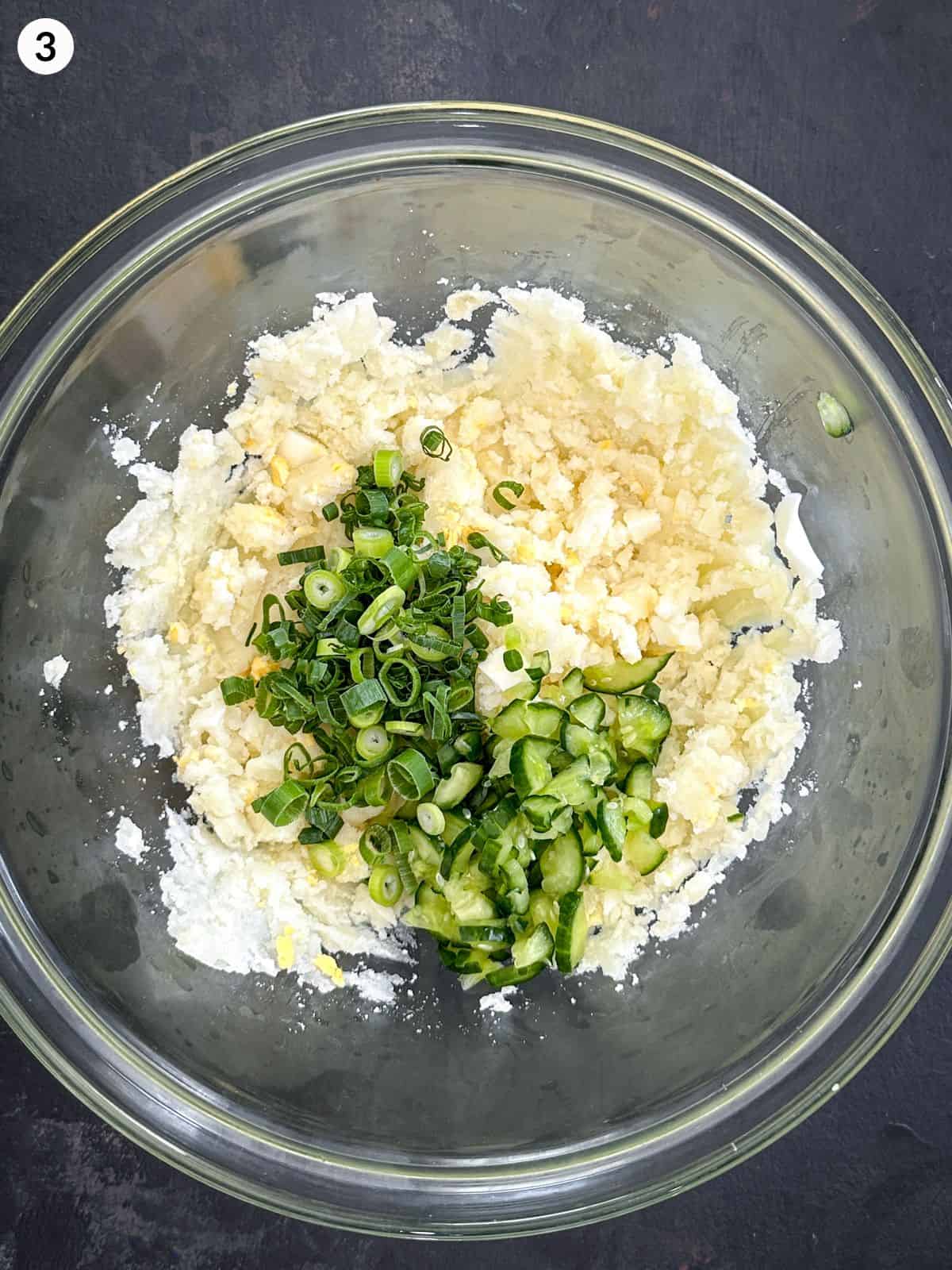 Ingredients for Korean potato salad in a glass bowl