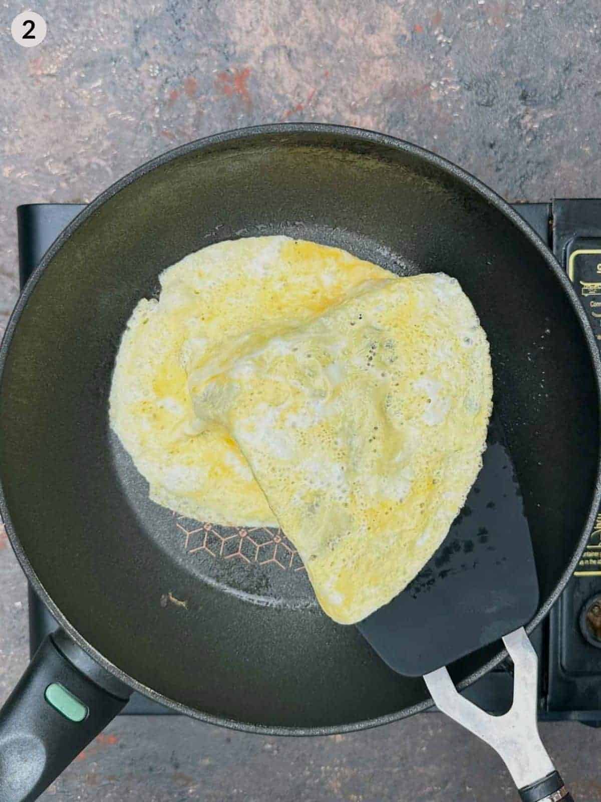 Frying omelette in a frypan