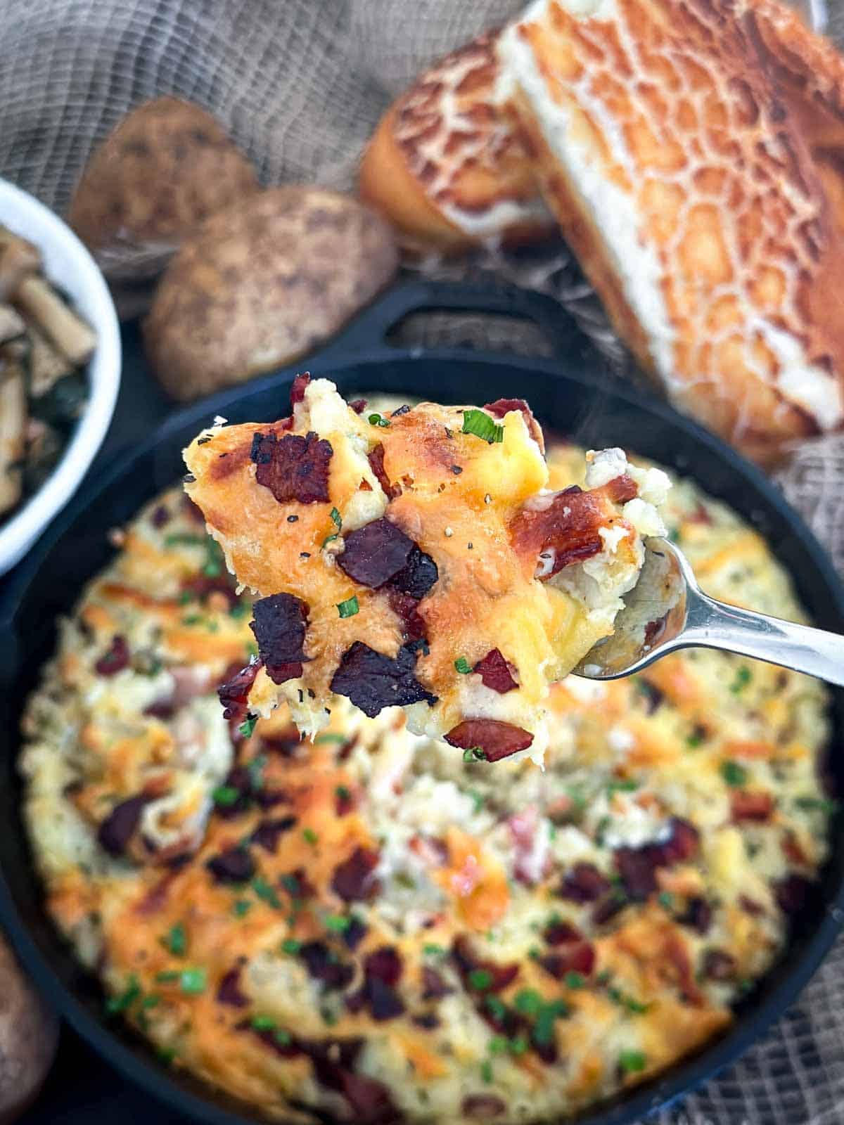 Twice Baked Mashed Potatoes served with bread and pasta