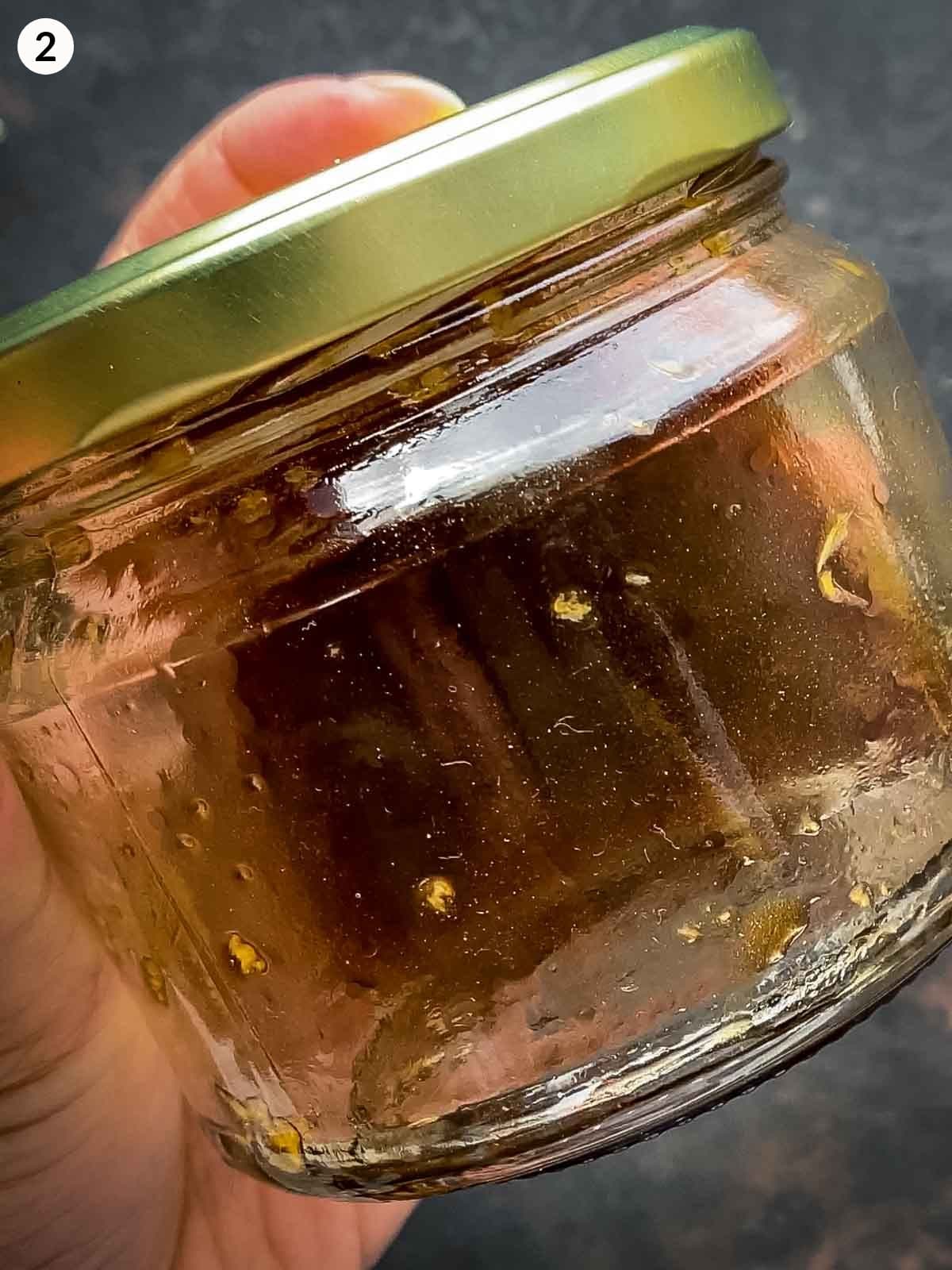 Shaking yuzu dressing ingredients in a jar