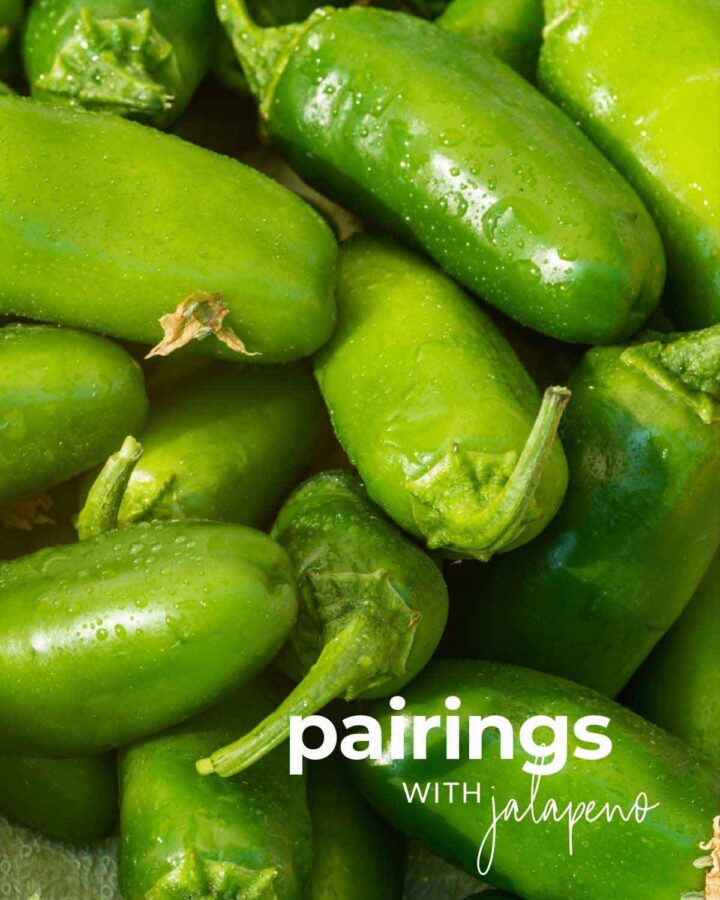 Bunch of fresh jalapenos that has just been washed with text overlay "pairings with jalapeno"