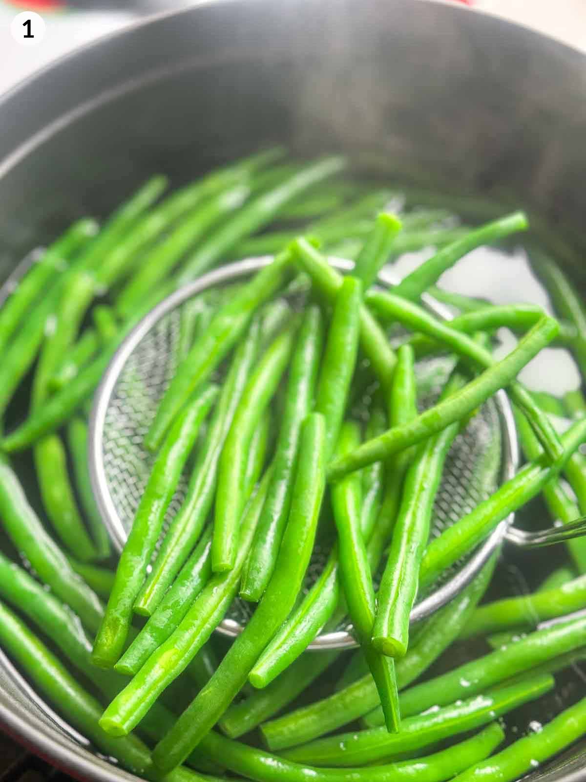 Blanching fresh green beans in boiling water until vibrant green — the first step to making Japanese sesame green beans (Gomaae).