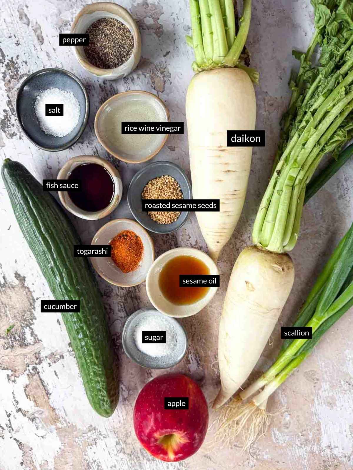 Individually labeled ingredients for Daikon Cucumber Apple Salad with Togarashi Dressing