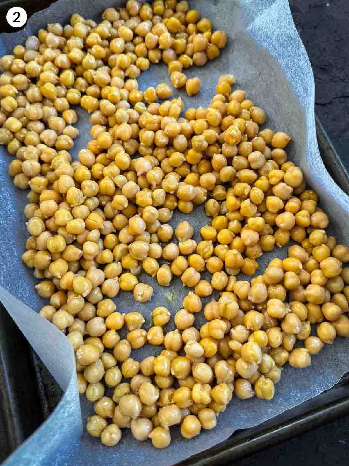 chickpeas on parchment lined sheet pan