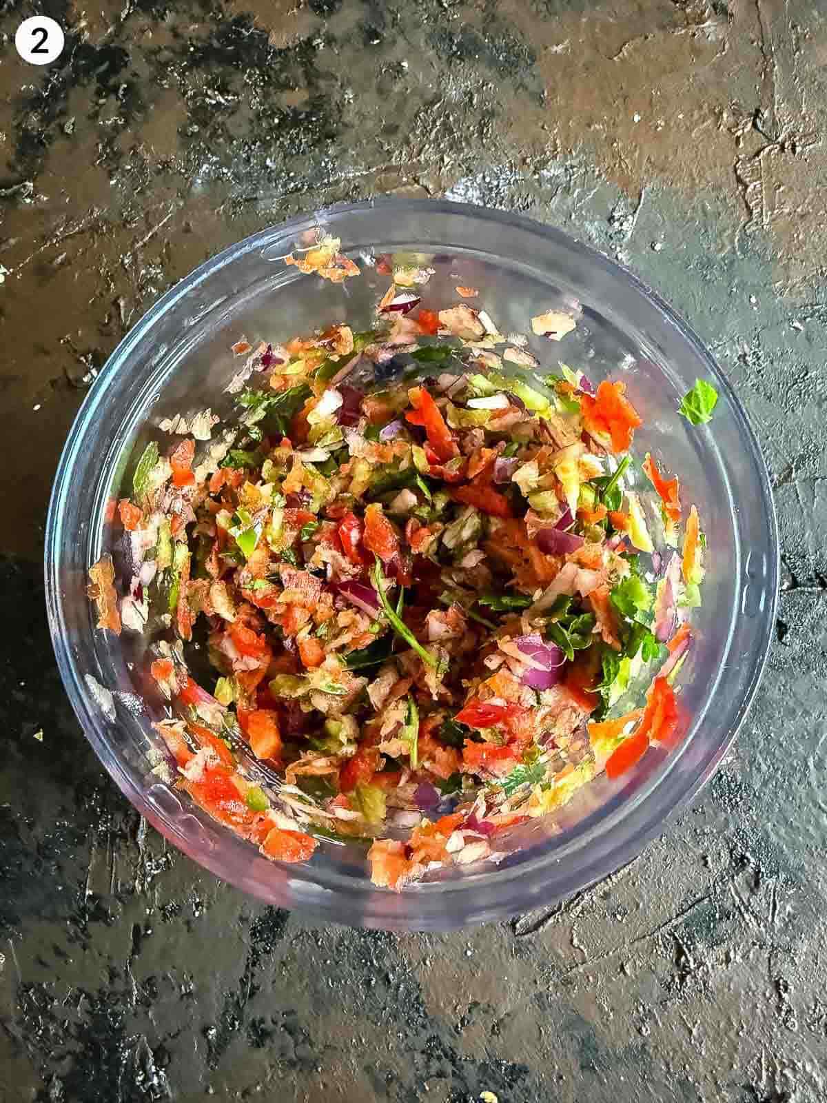 ezme salad ingredients chopped in a food processor